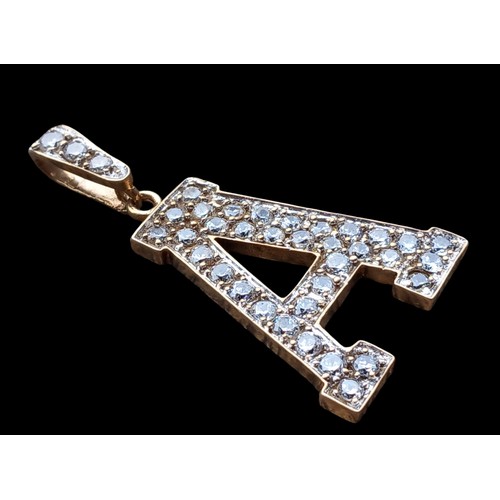 674 - A 9ct GOLD LETTER 