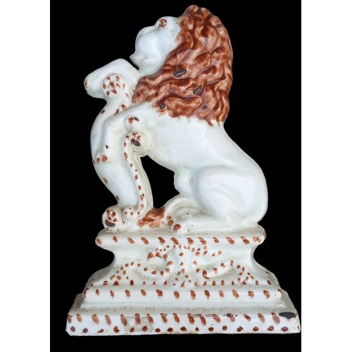 31 - AN ANTIQUE HEAVY GLAZED LION DOOR STOP 12