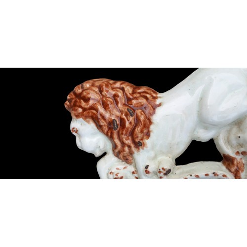 31 - AN ANTIQUE HEAVY GLAZED LION DOOR STOP 12