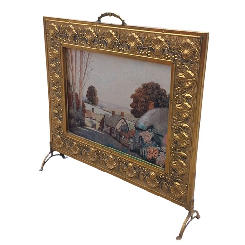 62 - A BRASS FIRESCREEN