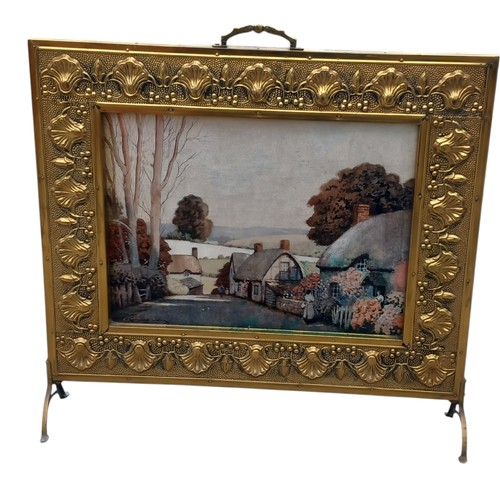 62 - A BRASS FIRESCREEN