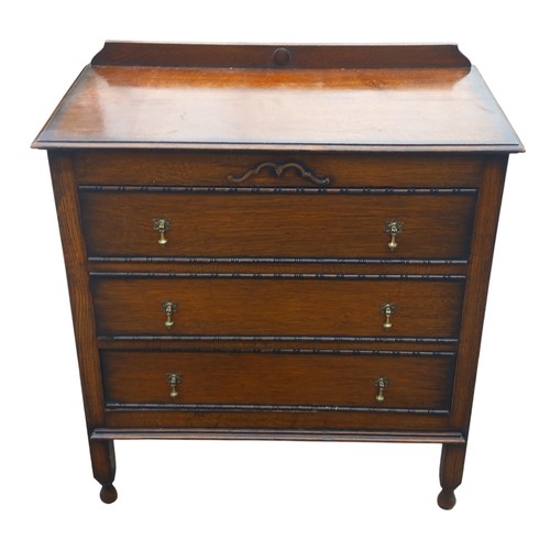 87 - AN OAK 3 DRAWER CHEST IN ARTS AND CRAFTS  STYLE