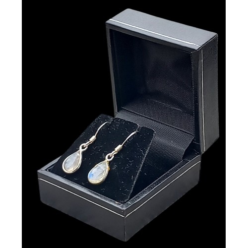 180 - A PAIR OF SILVER SET WITH MOONSTONES