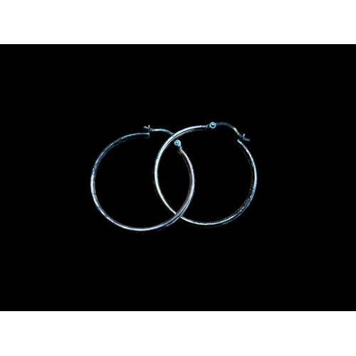 198 - A PAIR OF SILVER HOOP EARRINGS