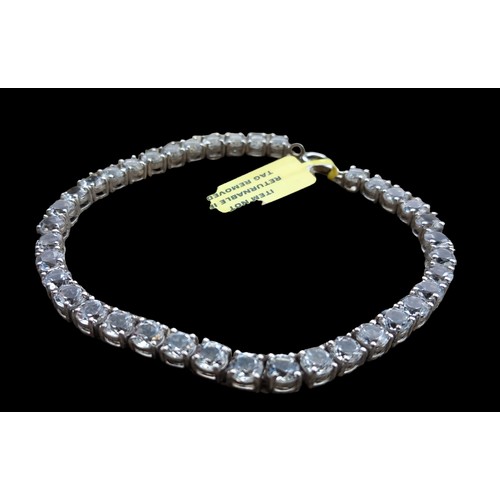 242 - A SILVER & WHITE CRYSTAL LINE BRACELET