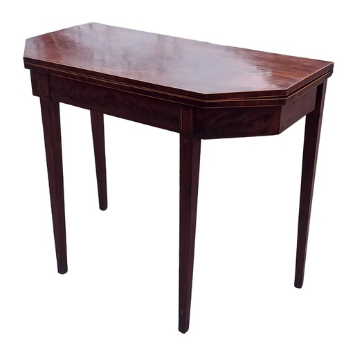 265 - A GEORGIAN MAHOGANY TURNOVER LEAF TABLE