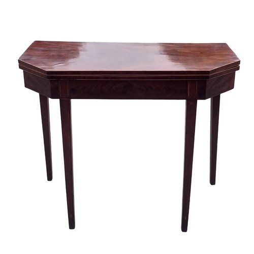 265 - A GEORGIAN MAHOGANY TURNOVER LEAF TABLE