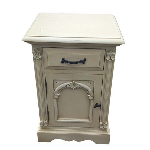 270 - A CREAM BEDSIDE WITH DRAWER OVER ARCHED PANEL DOOR