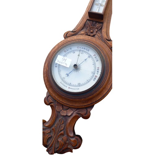 296 - A NICELY CARVED ANTIQUE OAK WALL BAROMETER (CRACKED GLASS)