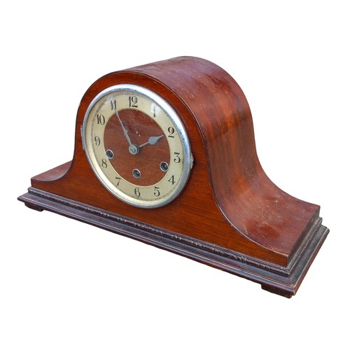 298 - A SHAPED MAHOGANY MANTLE CLOCK