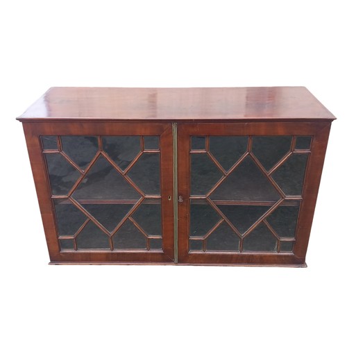 320 - A REGENCY MAHOGANY WALL HANGING CABINET