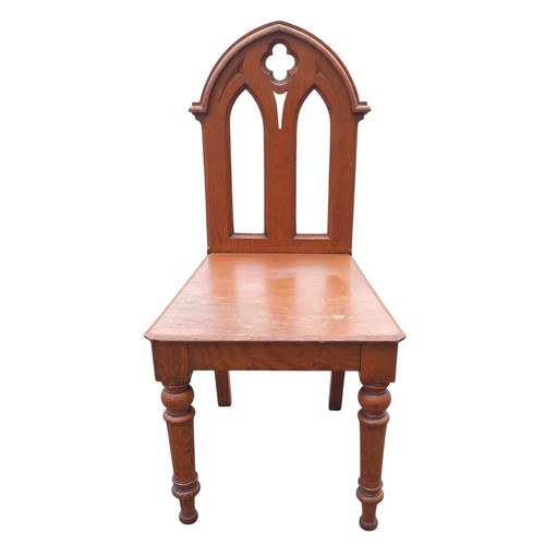 337 - A VICTORIAN OAK GOTHIC HALL CHAIR ON TURNED LEG