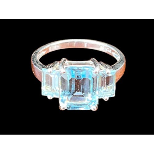 449 - A SILVER BLUE TOPAZ SET RING