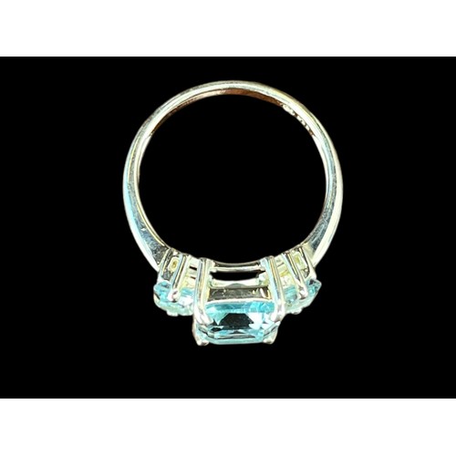 449 - A SILVER BLUE TOPAZ SET RING