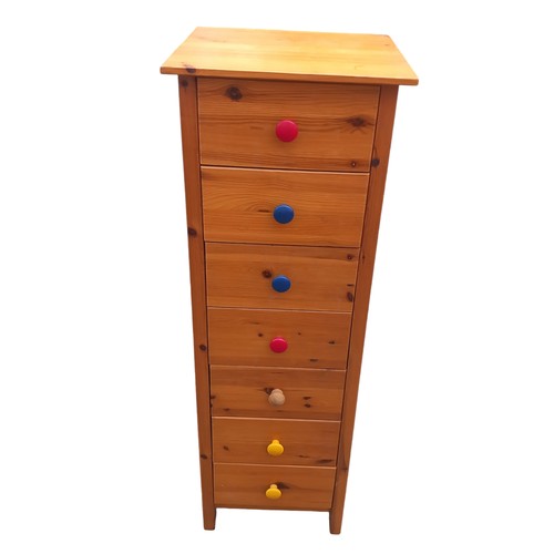 364 - A NARROW 7  DRAWER PINE CHEST OF DRAWERS