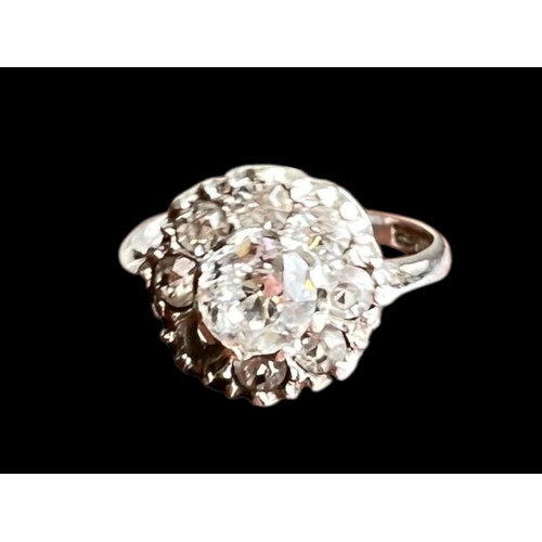 510 - A SILVER GEMSET CLUSTER RING (1 STONE MISSING)