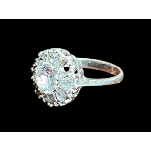 510 - A SILVER GEMSET CLUSTER RING (1 STONE MISSING)