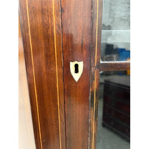 413 - A GEORGIAN ASTRAGAL GLAZED CORNER CUPBOARD WITH AN INLAID PANEL DOOR TO BASE