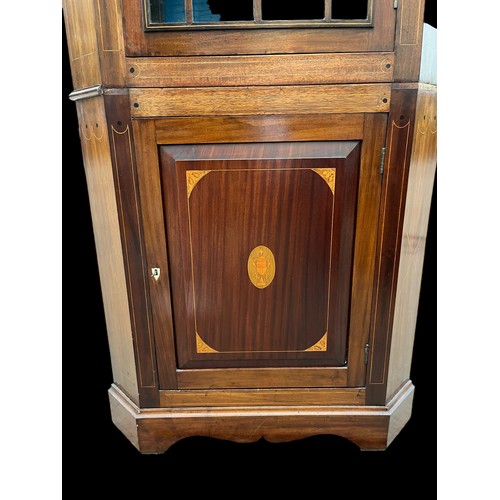 413 - A GEORGIAN ASTRAGAL GLAZED CORNER CUPBOARD WITH AN INLAID PANEL DOOR TO BASE