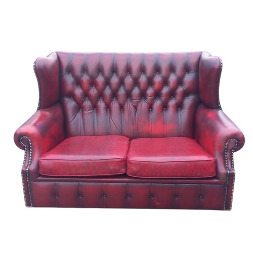 416 - A RED LEATHER BUTTONBACK 2 SEATER WINGBACK SETTEE