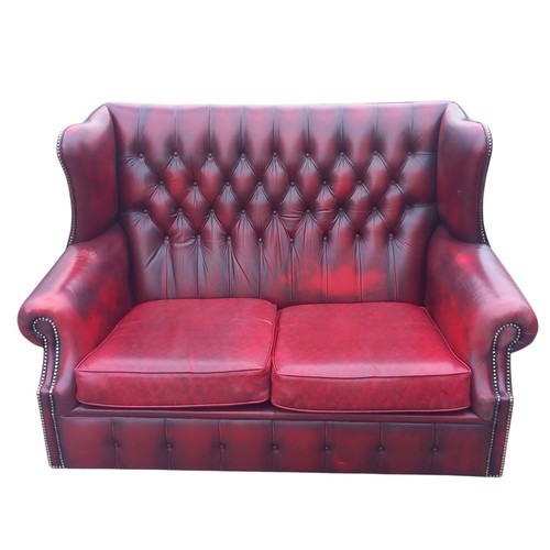 416 - A RED LEATHER BUTTONBACK 2 SEATER WINGBACK SETTEE