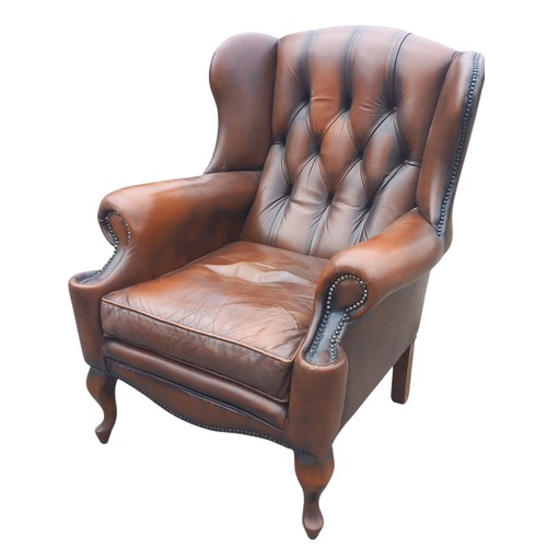 420 - A DARK BROWN LEATHER  DEEP BUTTON WINGBACK ARMCHAIR ON QUEEN ANNE LEG