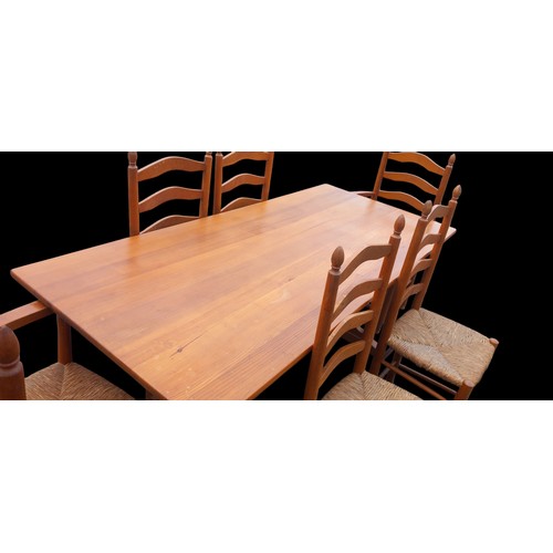 425 - A PINE ERCOL STYLE TRESEL TABLE WITH 6 CHAIRS TO MATCH