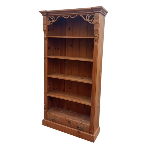 435 - A BEAUTIFULLY CARVED PINE OPEN SHELVING WITH DRAWER  TO BASE