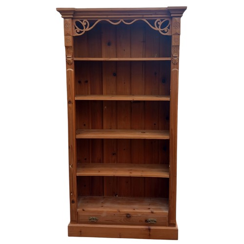 435 - A BEAUTIFULLY CARVED PINE OPEN SHELVING WITH DRAWER  TO BASE