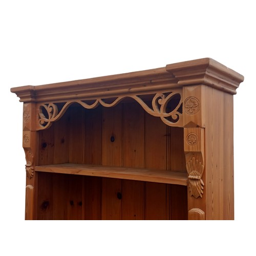 435 - A BEAUTIFULLY CARVED PINE OPEN SHELVING WITH DRAWER  TO BASE