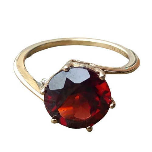 584 - A 10ct GOLD GARNET SET RING