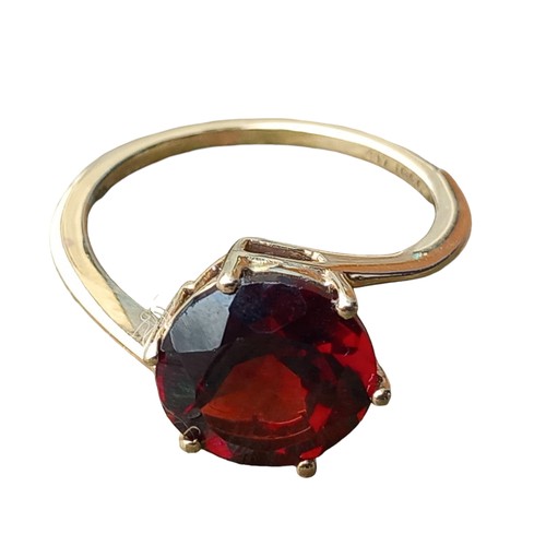 584 - A 10ct GOLD GARNET SET RING