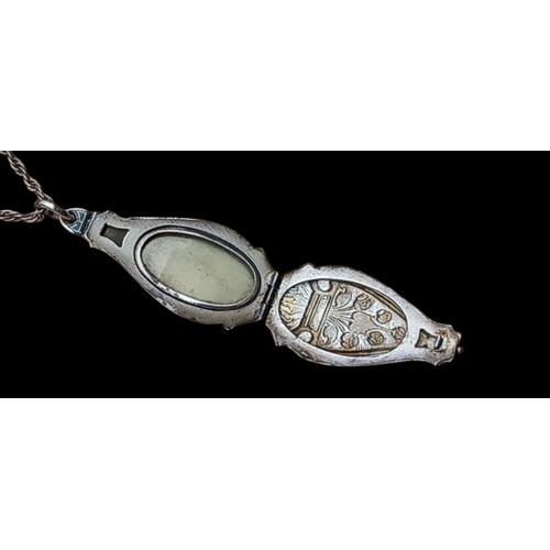 444 - AN EDWARDIAN SILVER AND ENAMEL LOCKET ON SILVER CHAIN