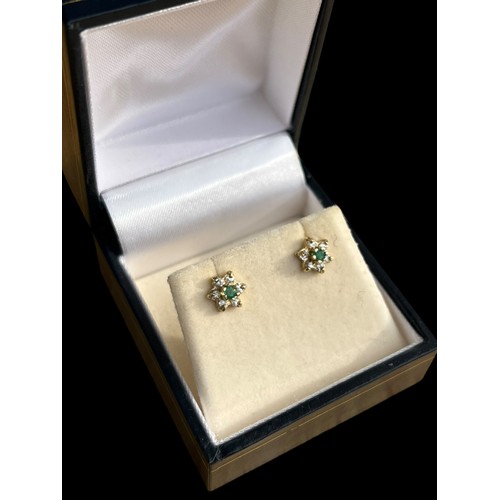 590 - A PAIR OF 9ct GOLD EMEARLD AND DIAMOND EARRINGS