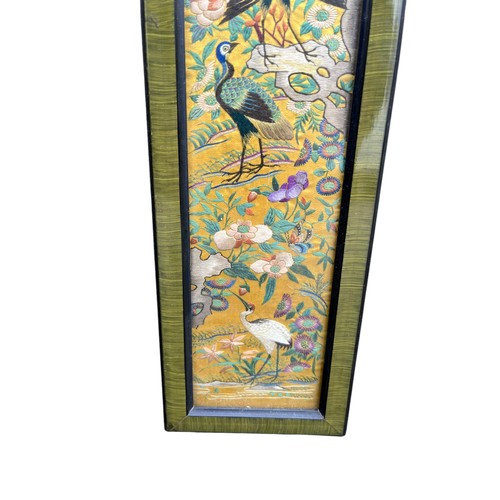 644 - A PAIR OF FRAMED PEACOCK SILKS