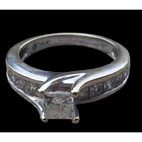 604 - A 14ct WHITE GOLD HIGH SET SQUARE DIAMOND RING WITH DIAMOND SHOULDERS