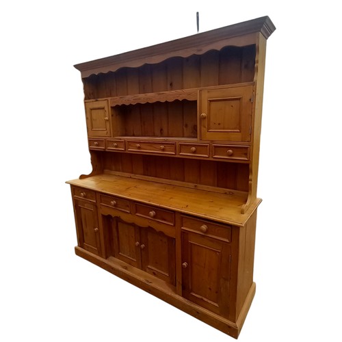 661 - A NICELY FITTED LARGE PINE DRESSER