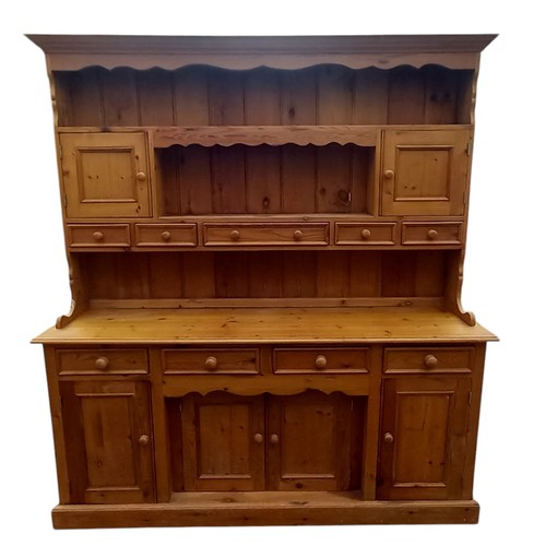 661 - A NICELY FITTED LARGE PINE DRESSER