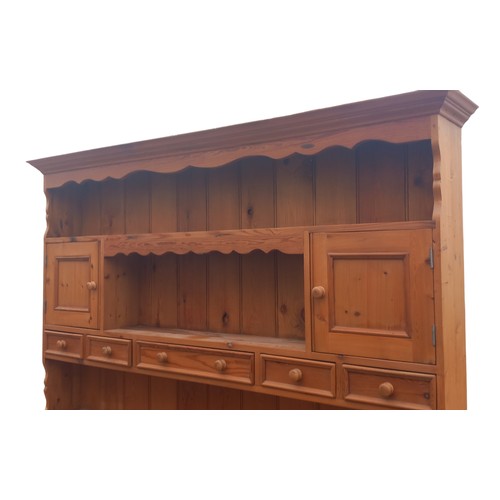 661 - A NICELY FITTED LARGE PINE DRESSER