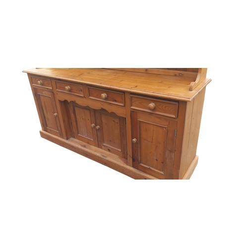 661 - A NICELY FITTED LARGE PINE DRESSER