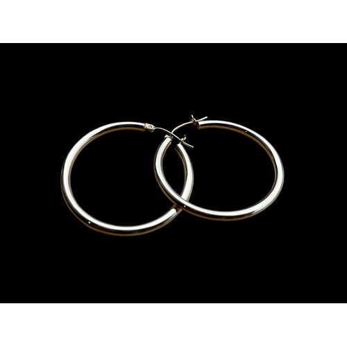 608 - A PAIR OF LARGE 9ct GOLD HOOP EARRINGS (SLIGHT DENT TO 1) 2..15 grm