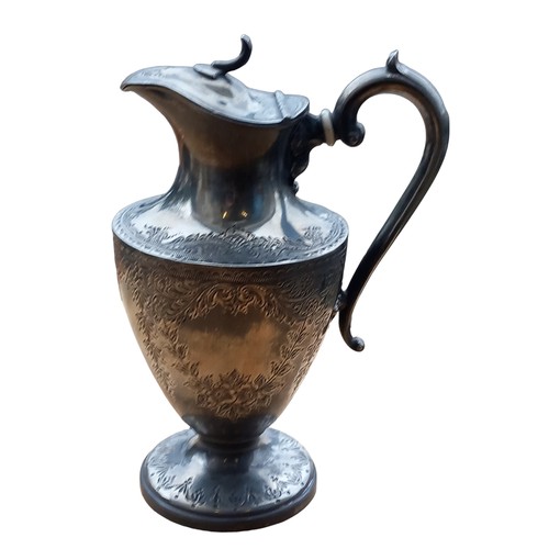 679 - AN ORNATE PEWTER ANTIQUE WATER JUG