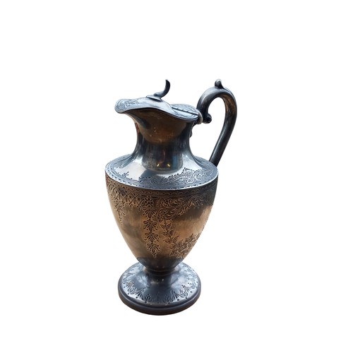 679 - AN ORNATE PEWTER ANTIQUE WATER JUG