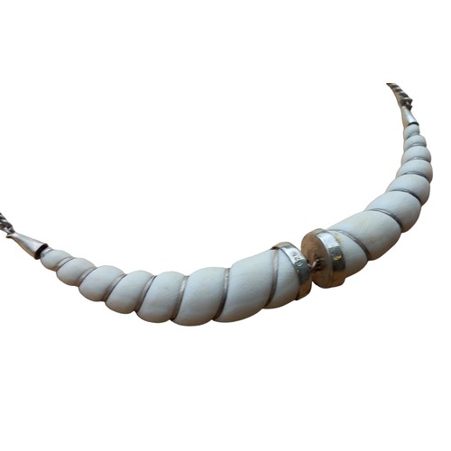 688 - A UNIQUE SILVER AND BONE NECKLACE FROM SOUTH AFRICA