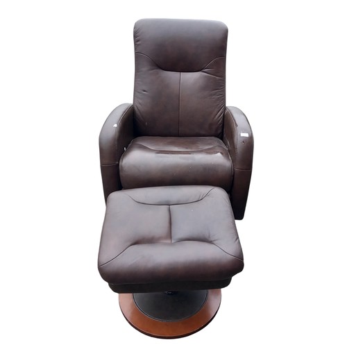 634 - A LAZY BOY BROWN LEATHER RECLINING ARMCHAIR AND MATCHING FOOTSTOOL