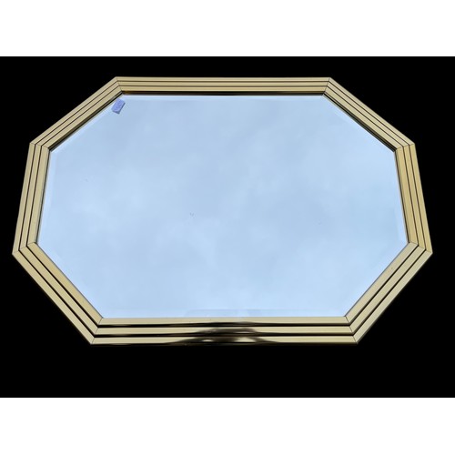 693 - A GILT HEXAGONAL BEVELL EDGE MIRROR APPROX 42X29