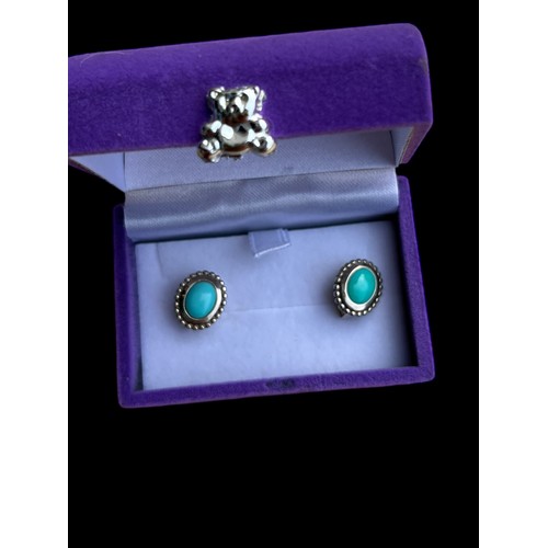 166A - A PAIR OF ORNATE SILVER AND TURQUOISE EARRINGS