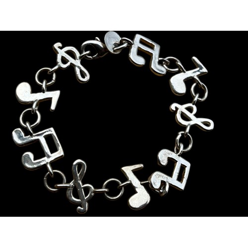 168A - A SILVER MUSICAL THEMED BRACELET