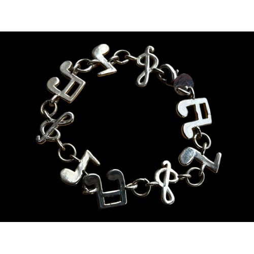 168A - A SILVER MUSICAL THEMED BRACELET