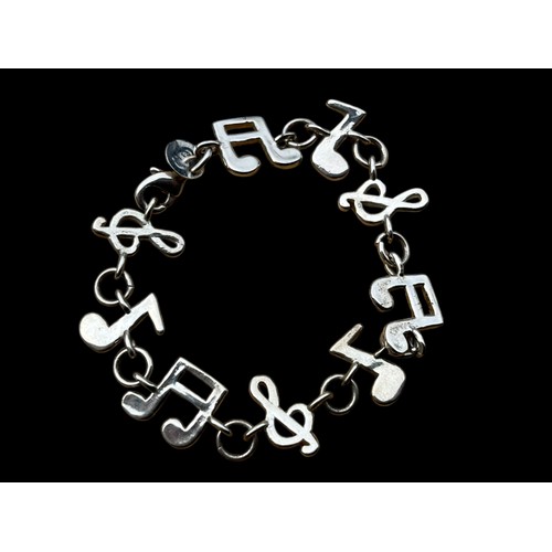 168A - A SILVER MUSICAL THEMED BRACELET